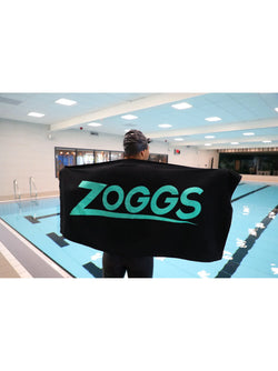 Zoggs Pool Towel. 140cm x 70cm. black/turquoise